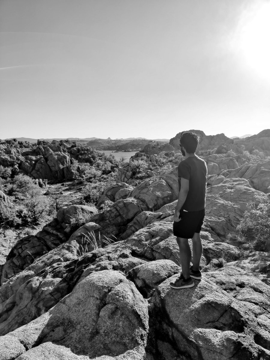 Ritwic standing in a rocky desert landscape
